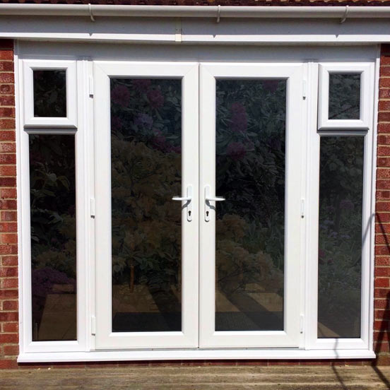 White uPVC French Doors with Opening Side windows installed